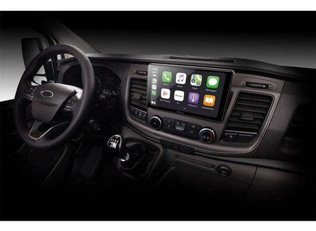 Car interior with a car headunit displaying Apple CarPlay, manual gear shift, and a sleek dashboard.