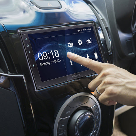 image of an individual using Apple CarPlay stereo
